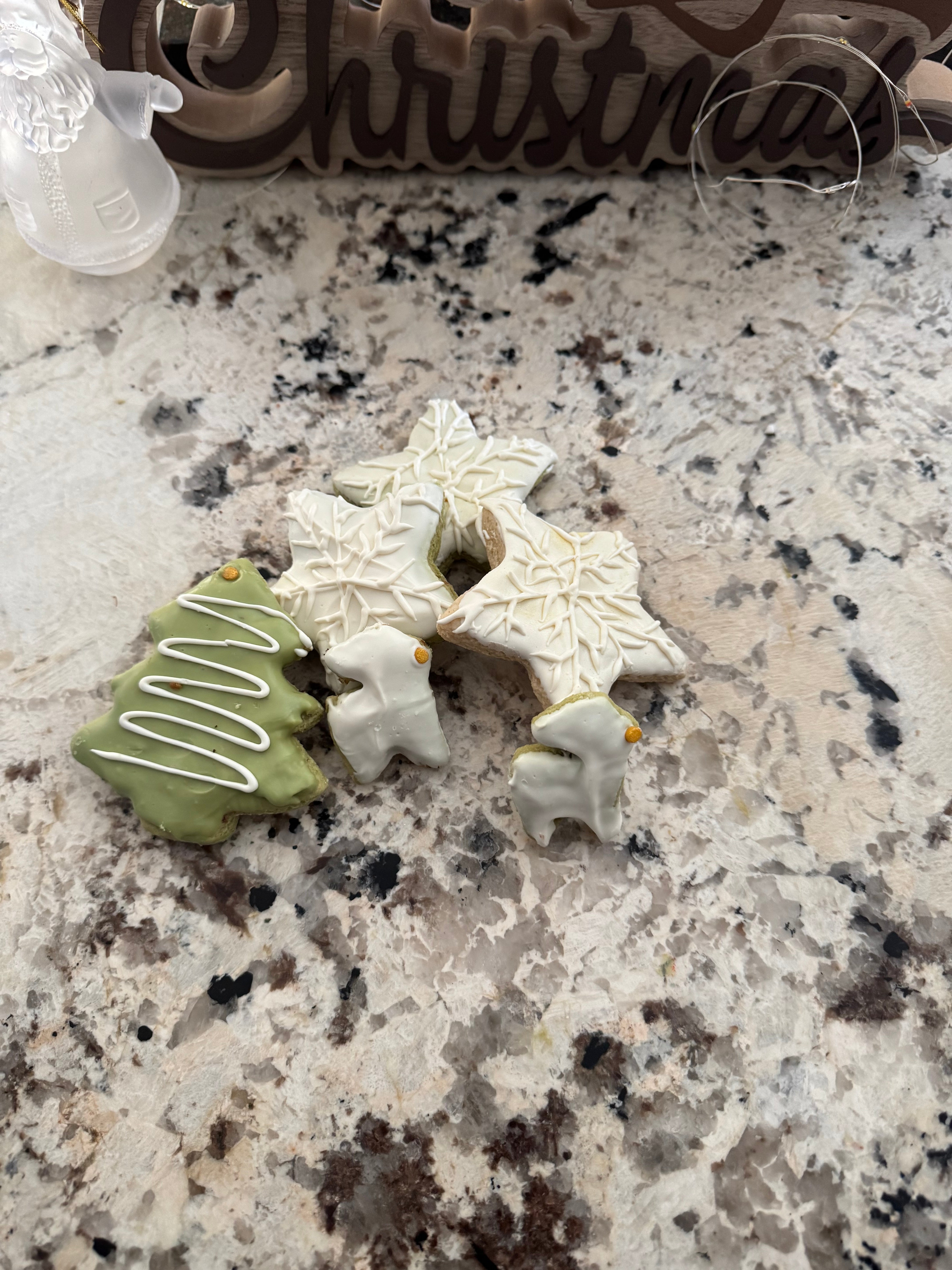 Decorative cookies on a speckled countertop